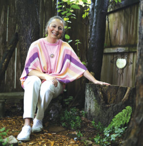 Photo of Susan Tromley in her garden by Brodie Curtsinger.